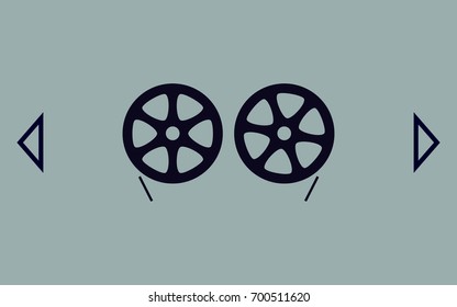 Flat paper cut style icon of old tape spool. Vector illustration