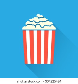 Flat popcorn icon on blue background with long shadow