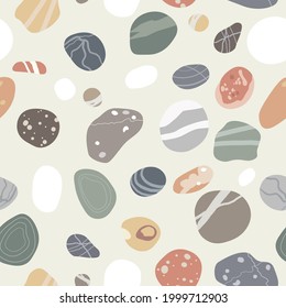 Flat sea pebbles seamless pattern. Small stones of different shapes and colors set.Vector illustration collection.