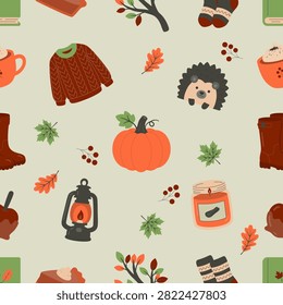 Flat seamless autumn pattern with pumpkin, sweater, hedgehog, lantern, candle, books, boots, hot drinks and fall leaves. Perfect for fabric, wrapping paper, wallpaper and seasonal designs.