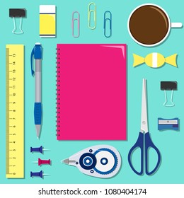 Flat set of stationery on the table with the notebook in the center.
