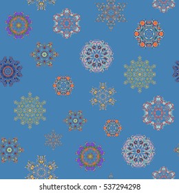 Flat snow doodle icons, snow flakes silhouette for christmas banner, cards. New year snowflake on blue background. Cute abstract seamless snowflakes vector pattern.