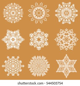 Flat snow doodle icons, snow flakes silhouette for christmas banner, cards. New year snowflake. Set of cute abstract snowflakes vector design on a orange background.
