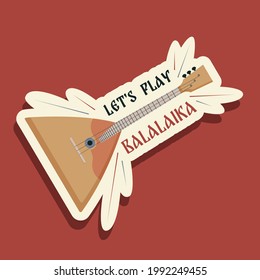 Flat style illustration with russian folk musical instrument balalaika and with the text Let's Play Balalaika. Original sticker for decoration, printing on clothes and various items. Russian flavor. 