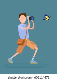 Flat style vector photographer male character tries to shoot a bird