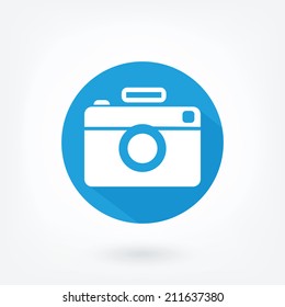 Flat styled icon of film camera. Hipster camera, like icon in blue circle with flash and long shaddow.