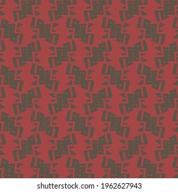 Flat surface decorated in red and black, with angular geometric elements. Textile or wallpaper pattern.