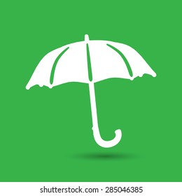 flat umbrella icon on the green background