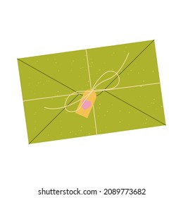 Flat vector cartoon illustration of a green paper envelope with a tag and tied with a rope. Isolated design on a white background. 