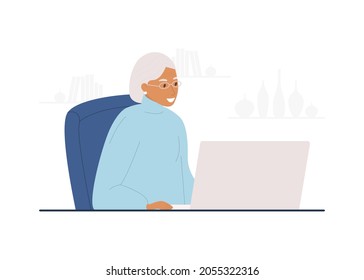 Flat vector cartoon illustration of a happy old woman sitting at a laptop. The concept of mastering the computer in old age.
