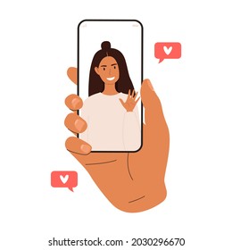 Flat vector cartoon illustration of a man's hand holding a mobile phone with a woman on the screen. The concept of online dating. Isolated design on a white background.