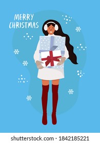 Flat vector cartoon illustration of a smiling girl holding Christmas gifts and the inscription merry Christmas on a blue background.