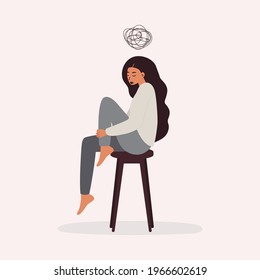 A flat vector cartoon illustration of a woman in a depressed mood, sitting on a chair and holding her knees, scribbling over her head. Mental health problems, burnout, depression.