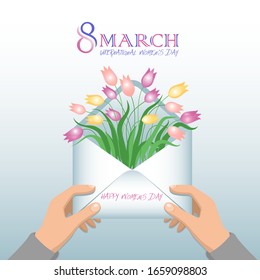 

Flat vector design.
Envelope in men's hands, in an open envelope spring flowers - tulips. Congratulations for women, mothers, girls on International Women's Day on March 8.