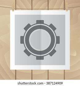 Flat vector icon. Color photo hanging on a rope. Gear.