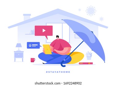 Flat vector illustration of cartoon male character protected by huge umbrella and working from home while staying home during quarantine. Social media campaign and coronavirus prevention