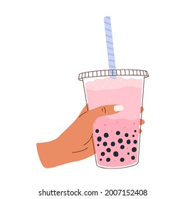 Flat vector illustration of a hand holding cold Taiwanese tea with milk and tapioca in a plastic cup. Isolated design on a white background.