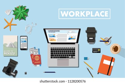 Flat view top down to the working space table with laptop,travel book,camera with lenses,passport and plane ticket, credit card and coffee with copy space for your text -workplace