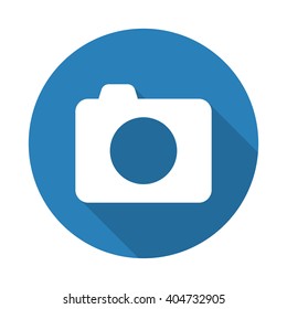 Flat white Camera web icon with long drop shadow on blue circle