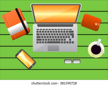 flat workspace top view, laptop, smart phone, glasses, notebook, wallet, on a green board