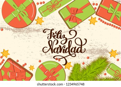 Flatlay mockup with fir, bright gift boxes with bow, beads and stars on rustic background with lettering Feliz Navidad (Merry Christmas in Spanish) greeting card, invitation, poster, banner