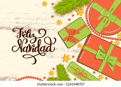 Flatlay mockup with fir, bright gift boxes with bow, beads and stars on rustic background with lettering Feliz Navidad (Merry Christmas in Spanish) greeting card, invitation, poster, banner