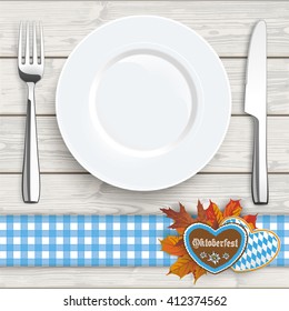 Flatware and gingerbread with text "Oktoberfest" on the wooden background. Eps 10 vector file.