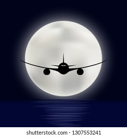 Flight of the plane over the sea on a background of a bright disk of the full moon