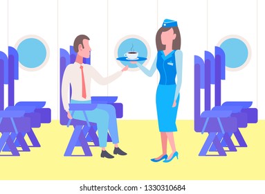 Flight stewardess serving drinks to businessman airplane passenger sitting comfortable seat during business trip modern plane board interior full length horizontal