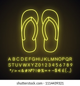 Flip flops neon light icon. Summer slippers. Glowing sign with alphabet, numbers and symbols. Vector isolated illustration