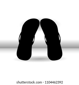 Flip-flops on a white background. Vector illustration, isolated solid black contour for advertising design, tourist pamphlets and magazines.