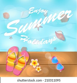 Flip-flops and sunglasses near water on wooden deck
