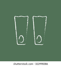 Flippers hand drawn in chalk on a blackboard vector white icon isolated on a green background.