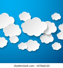 Floating Paper Clouds Background - Vector floating paper clouds on a blue background.  EPS10 file with transparency.