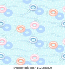 Floating pool inflatable rings seamless vector pattern. Rubber hoops on blue water background.