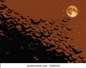 Flock of bats flying toward the full moon