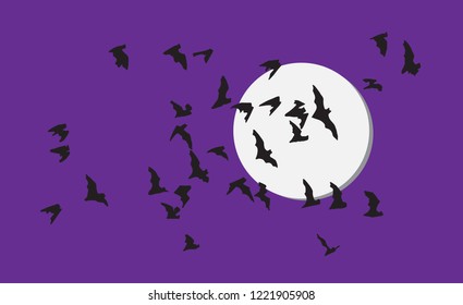 Flock of bats over moon