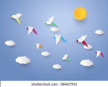 Flock of birds flying in the sky , paper art style