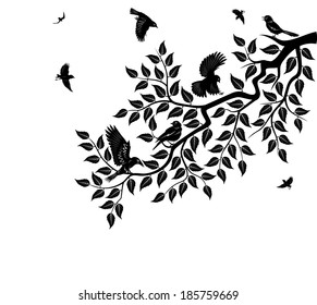Flock of birds sits on branch of tree. Tree branch with leaves.