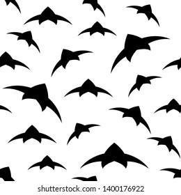 A flock of birds in the sky. Seamless pattern. Black and white vector background EPS10