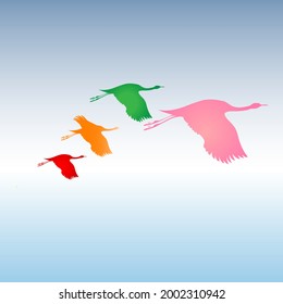 A flock of colorful birds on the sky