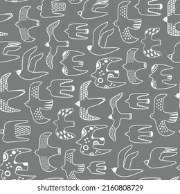 Flock of flying birds isolated on a dark gray background. Vector seamless pattern with migratory birds. Doodle backdrop for textile, wrapping paper, wallpaper. Stylised outline illustration.