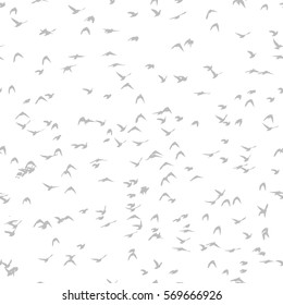 A flock of flying birds. seamless background. Vector