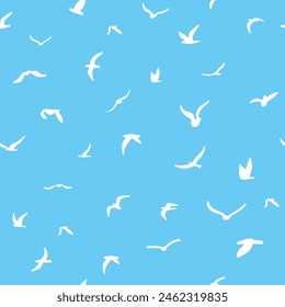 Flock of flying silhouette birds. Birds seamless pattern. White seagulls on a blue background. Vector illustration. 