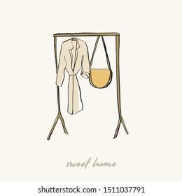 floor coat hanger with a robe and wicker bag