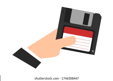 Floppy disk in hand,  Magnetic diskette. Digital data device. Flat style. White background