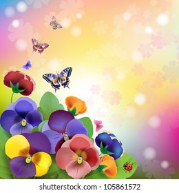 Floral background, colorful pansies flowers in the meadow