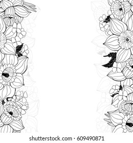 Floral background with spring flowers. Daffodils forming borders with space for text.