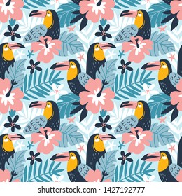 Floral background with tropical flowers, leaves and toucans. Vector seamless pattern for stylish fabric design. 