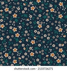 Floral background in vintage style. Decorative embroidery flowers. Vector seamless pattern. Ornament for textiles on dark blue background. Small white flowers. The template for fashion prints.
